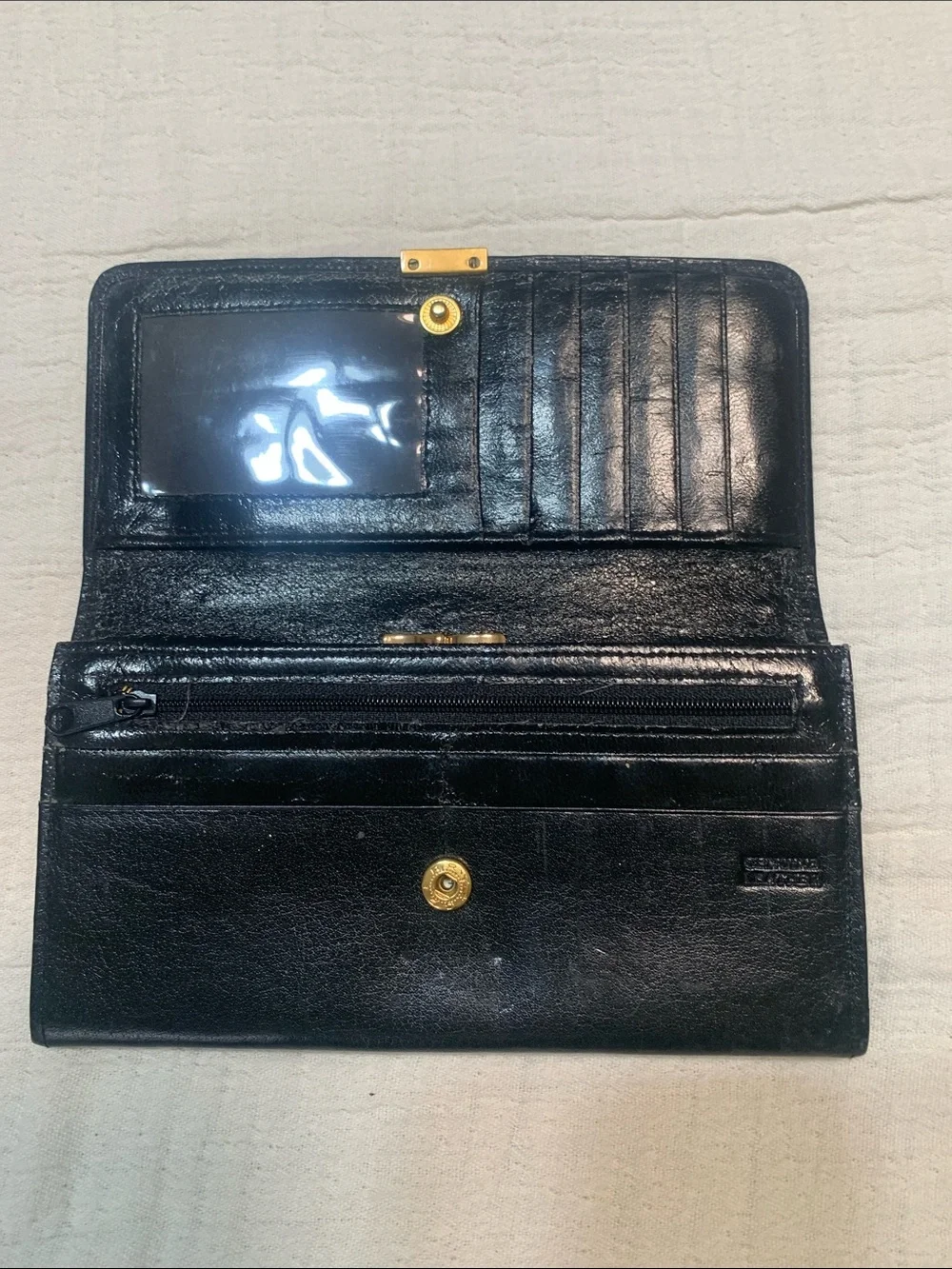 Vintage Carla Banti black leather clutch with signature gold tone plaque